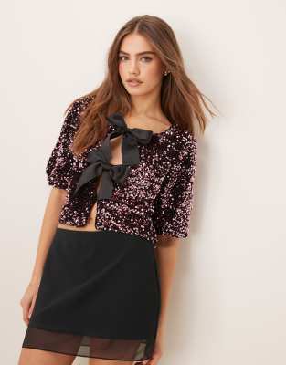 Gina Tricot sequin short sleeve top with satin bow front in pink Gina Tricot