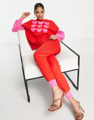 Трикотажные брюки Never Fully Dressed контрастного розового и красного цвета — часть комплекта. NEVER FULLY DRESSED