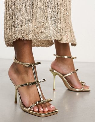 Босоножки на высоком каблуке с зеркальным золотом Simmi London Exclusive Riva SIMMI Shoes
