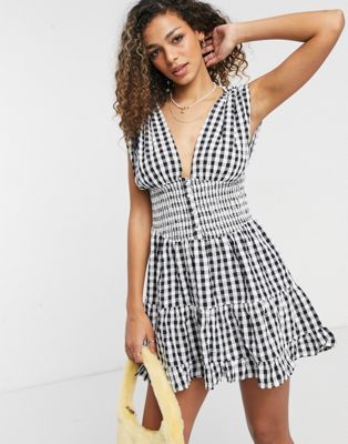 ASOS DESIGN shirred waist button front tiered mini sundress in crinkle in gingham ASOS DESIGN