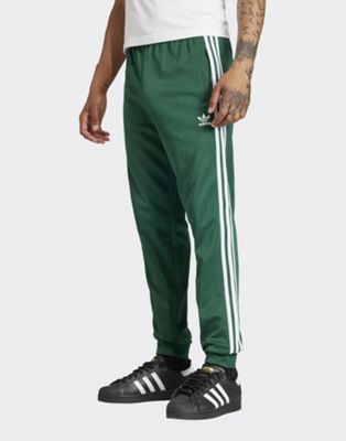 Брюки-джоггеры Adidas Originals Superstar в цвете колледжейской зелени Adidas