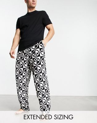 Черный пижамный комплект из футболки и брюк ASOS DESIGN с флисовым принтом внизу ASOS DESIGN