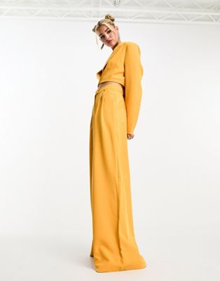 Оранжевые широкие брюки с напуском Kyo The Brand — часть комплекта KYO