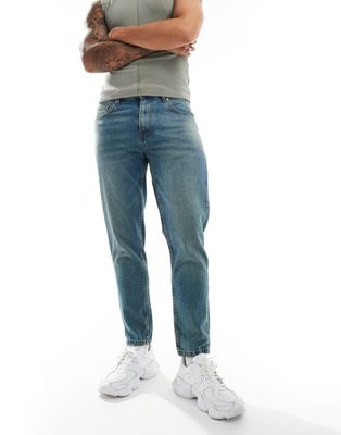 DTT rigid cropped tapered fit jeans in mid blue vintage tint Don't Think Twice