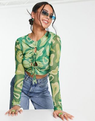 Another Reason cut out mesh crop top in green abstract graphic Another Reason