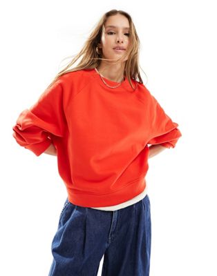 ASOS DESIGN oversized sweatshirt with raglan detail in red ASOS DESIGN