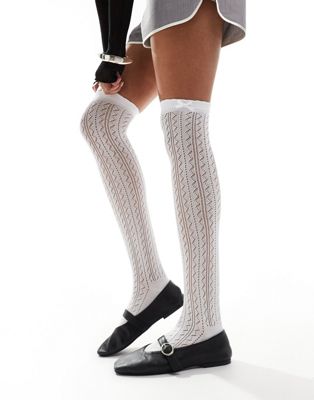COLLUSION high knee pointelle socks with bow in white Collusion