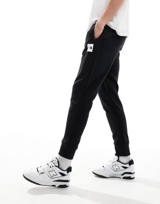 The North Face Box NSE sweatpants in black The North Face