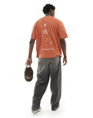 ASOS DESIGN oversized T-shirt in orange with celestial back print ASOS DESIGN