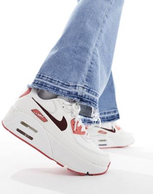 Кроссовки Nike Air Max 90 LV8 SE в кремово-белом и темно-красном цветах. Nike