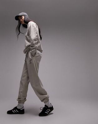Большие спортивные штаны с манжетами и принтом Topshop Los Angeles в винтажном стиле — часть комплекта TOPSHOP