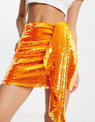 Гламурная мини-юбка с завязкой спереди из ярко-оранжевых пайеток. GLAMOROUS