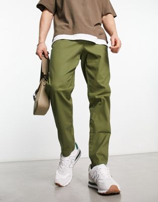 Темно-зеленые зауженные брюки чиносы ASOS DESIGN ASOS DESIGN