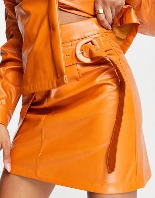Amy Lynn PU mini skirt with slit detailing in tangerine Amy Lynn