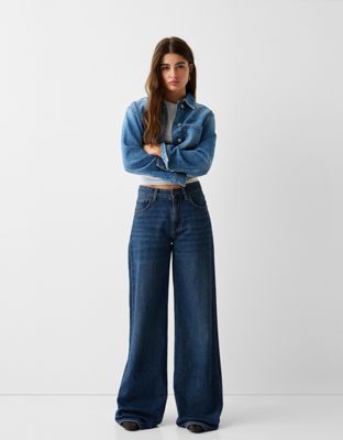 Bershka Petite high waisted wide leg jeans in dark blue Bershka