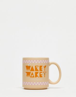Typo 'wakey wakey' mug in beige with pink checkerboard Typo