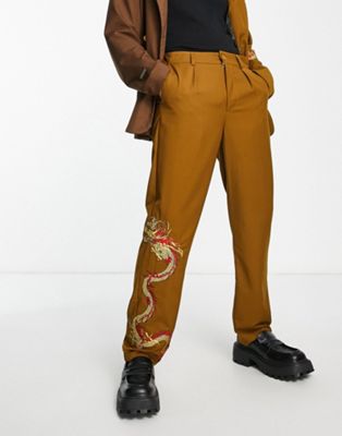 Liquor N Poker relaxed fit suit pants in brown with placement dragon print Liquor N Poker