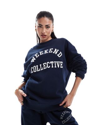 ASOS DESIGN Weekend Collective oversized sweatshirt with varsity logo in navy ASOS Weekend Collective