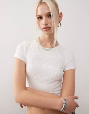 Monki shrunken fit top with frill heart graphic in white Monki