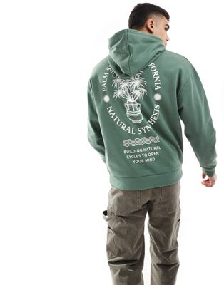 ASOS DESIGN oversized hoodie in dark green with floral back print ASOS DESIGN