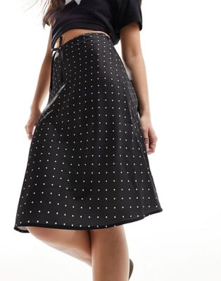 Monki satin a-line midi skirt with front bow detail in black and white polka dot Monki