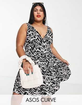 ASOS DESIGN Curve tiered sundress with button waist detail in black and cream abstract print ASOS Curve