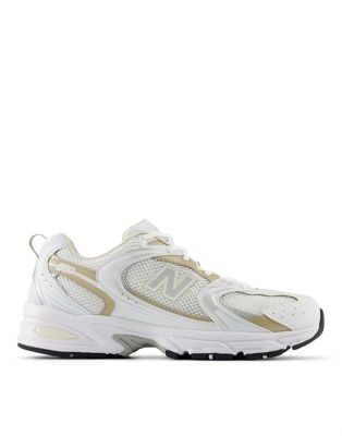 New Balance 530 sneakers in white and gold detail New Balance