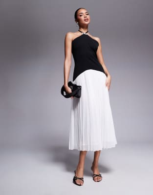 Rare London bow detail halterneck dropped waist pleated midi dress in black & white mono Rare Beauty by Selena Gomez