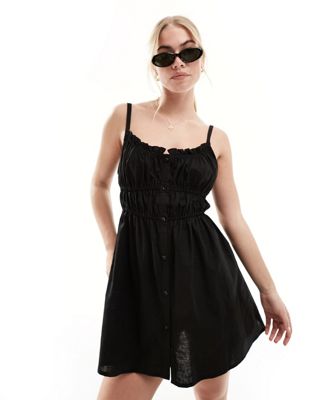 SNDYS linen ruched strappy mini dress in black SNDYS
