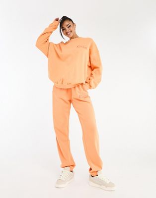 Оранжевые спортивные штаны оверсайз The Couture Club — часть комплекта The Couture Club