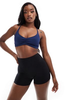 ASOS 4505 light support ruched front strap back sports bra in navy ASOS 4505