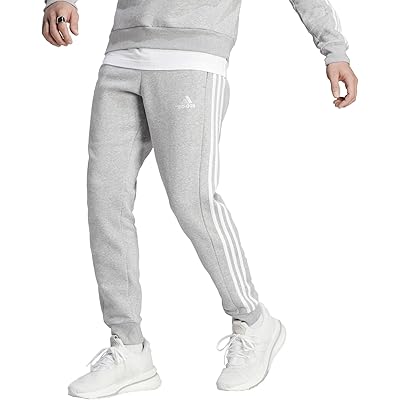 Уютные спортивные брюки с манжетами Adidas Essentials Fleece, изготовленные из 20% переработанных материалов Adidas