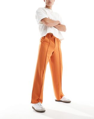 ASOS DESIGN wide leg dress pants with pintucks and side slits in rust ASOS DESIGN