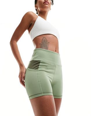 Зеленые шорты Nike Dri-FIT Road To Wellness размером 4 дюйма Nike
