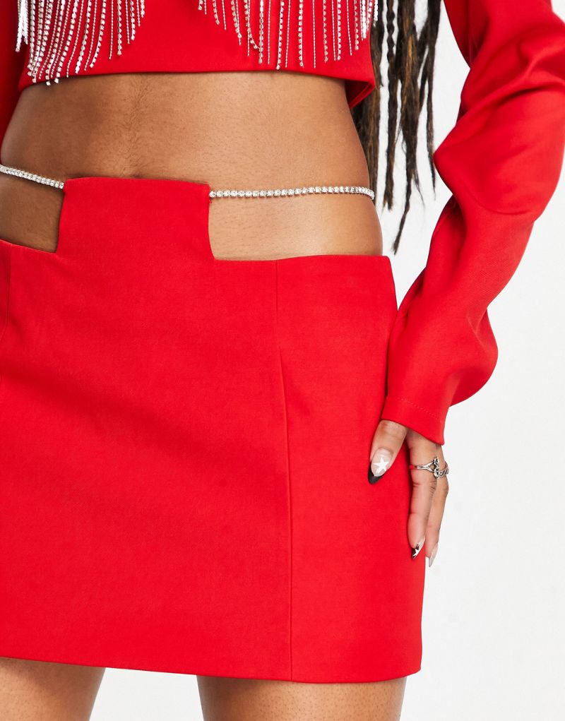 Красная мини-юбка Kyo The Brand с вырезанными стразами деталями из комплекта. KYO