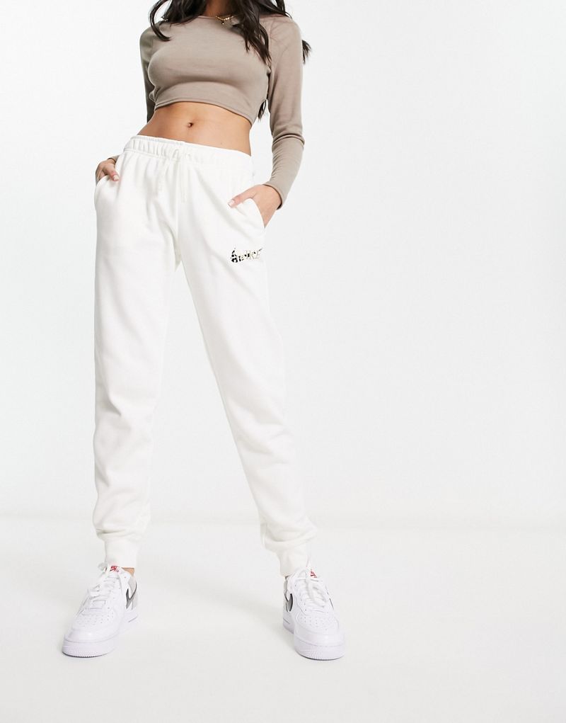 Белые спортивные брюки с логотипом и животным принтом Nike Nike