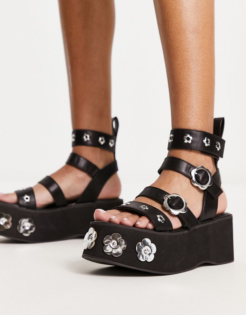 Черные сандалии на плоской подошве с цветочным принтом KOI Fuzzy Logic Koi Footwear