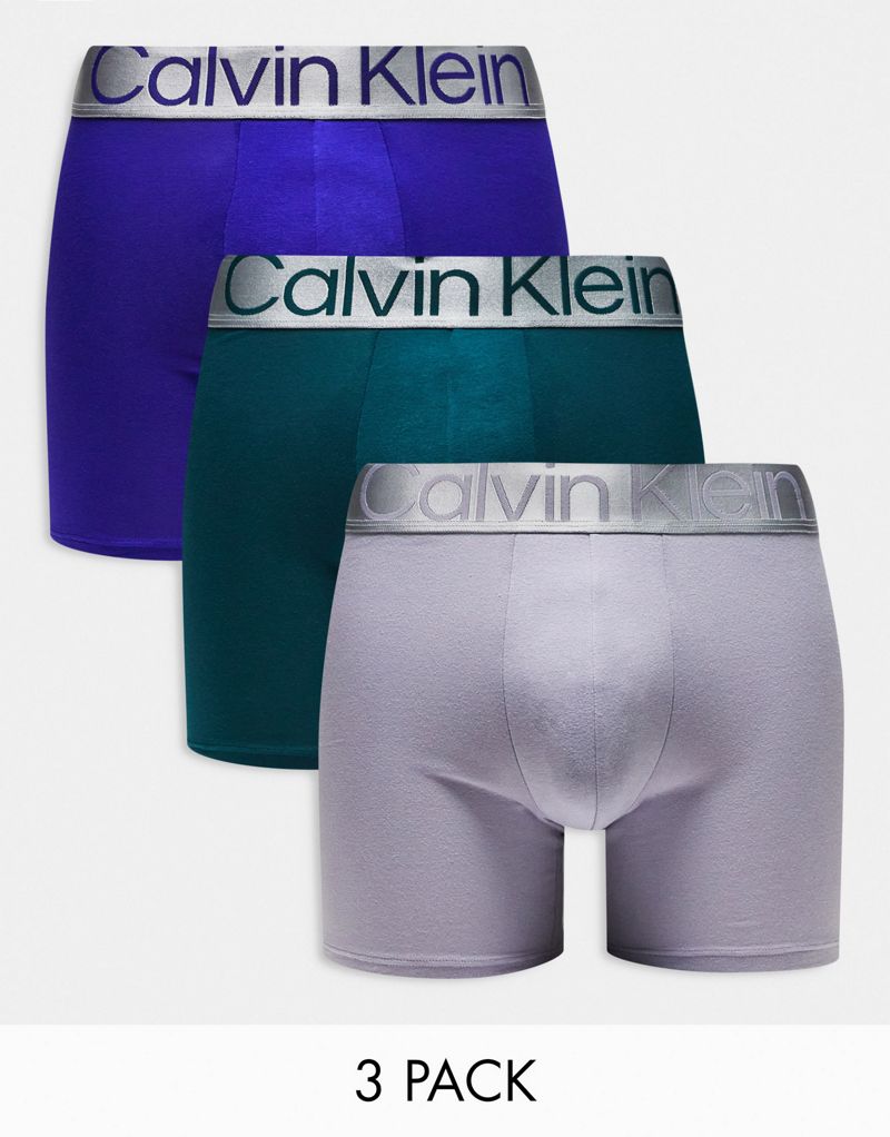 Комплект боксеров из трех стальных трусов Calvin Klein синего, серого и бирюзового цвета. Calvin Klein