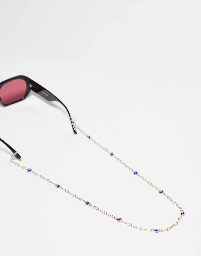ASOS DESIGN sunglasses chain with eye detail in gold tone ASOS DESIGN