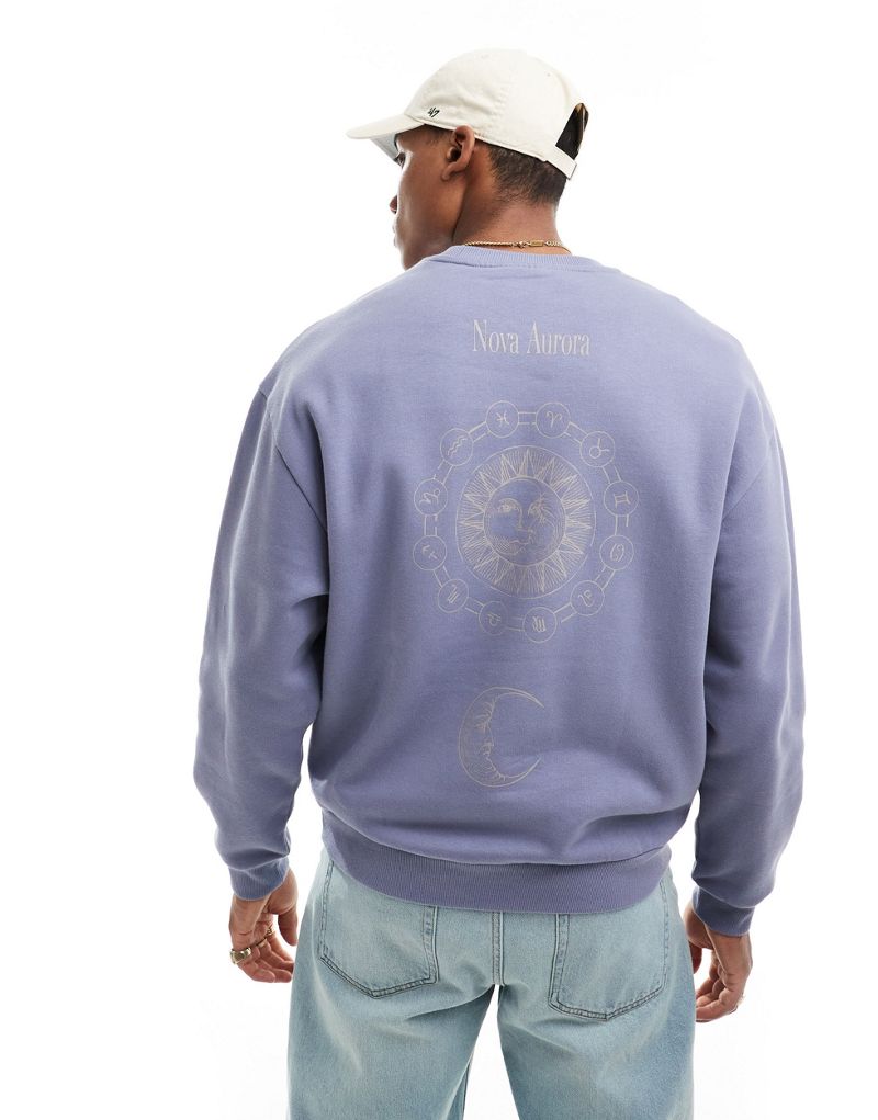 ASOS DESIGN oversized sweatshirt in blue with spine print ASOS DESIGN