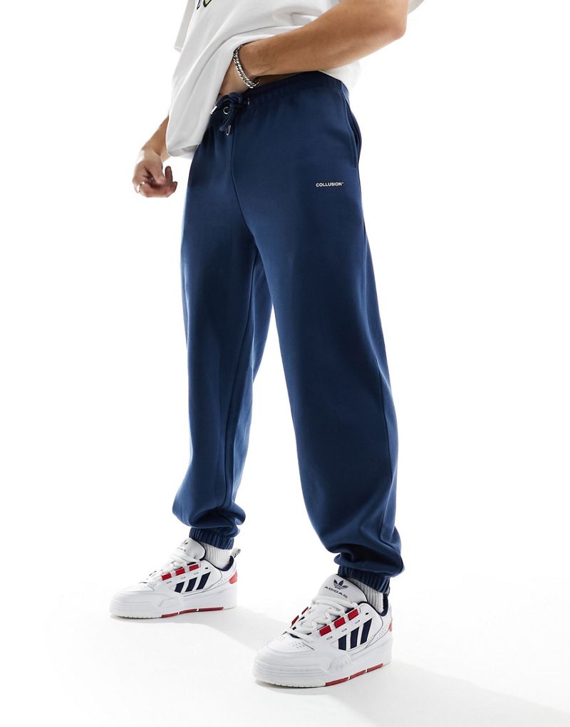COLLUSION Logo sweatpants in navy blue Collusion