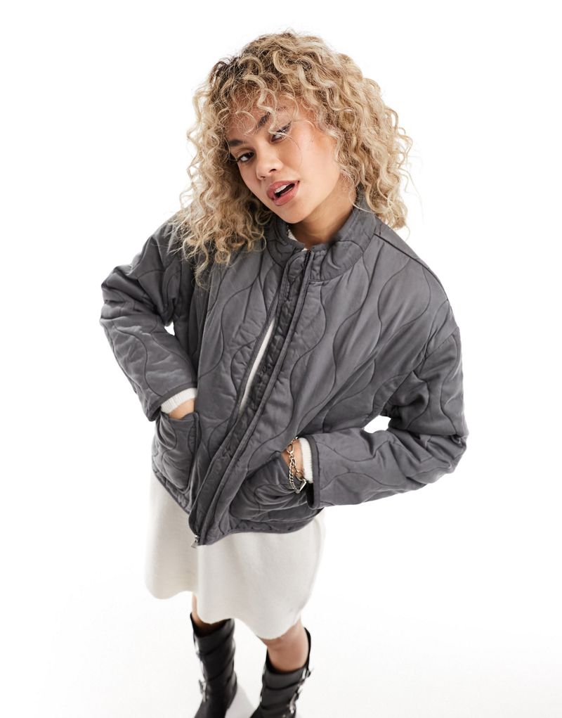 Only onion quilted jacket with oversized pockets in washed gray  ONLY