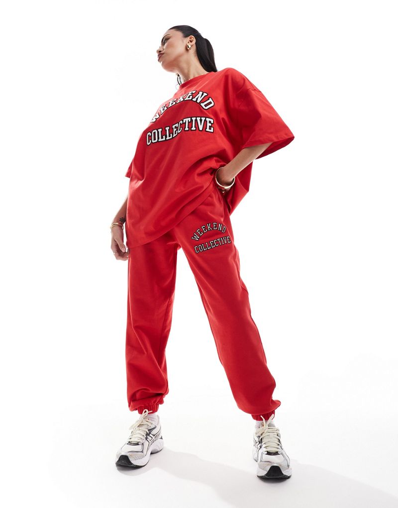 ASOS DESIGN Weekend Collective oversized sweatpants with varsity logo in red ASOS Weekend Collective