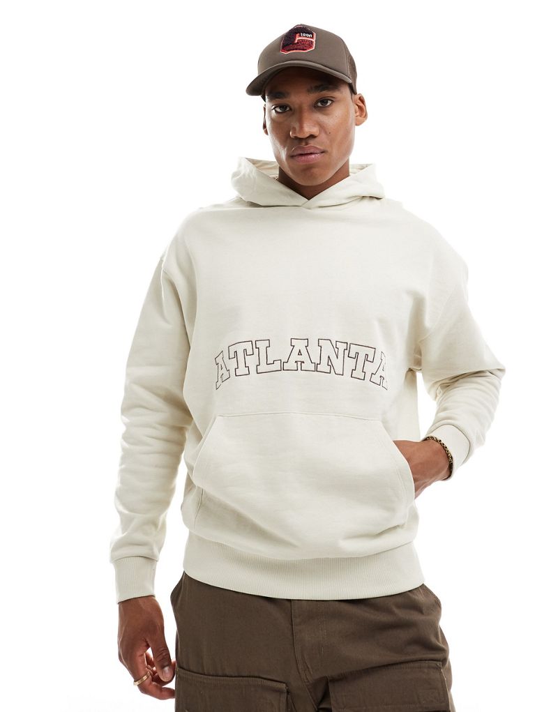 ASOS DESIGN oversized hoodie in beige with front city embroidery print ASOS DESIGN