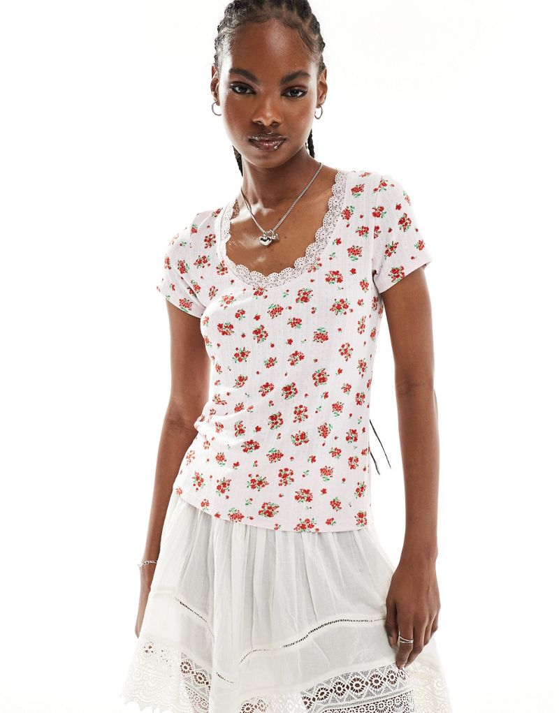 Monki pointelle top with scoop neck and lace trim in pink and red floral print Monki