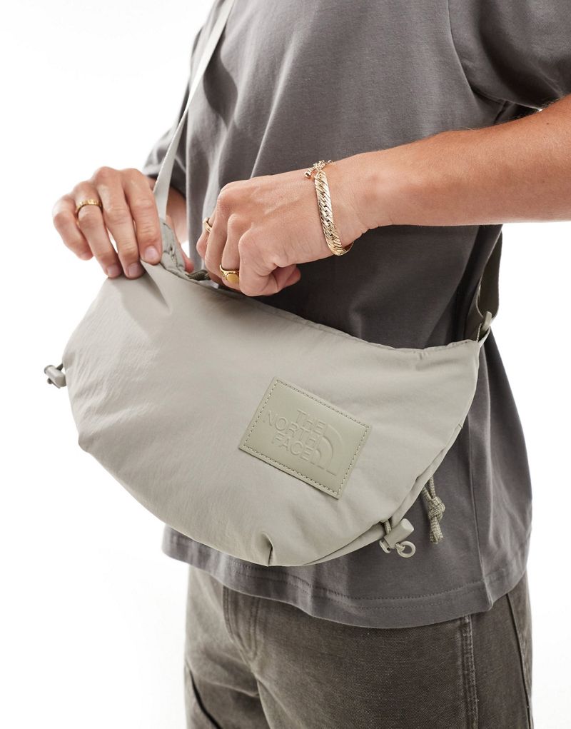 The North Face Never Stop sling cross body bag in clay gray The North Face