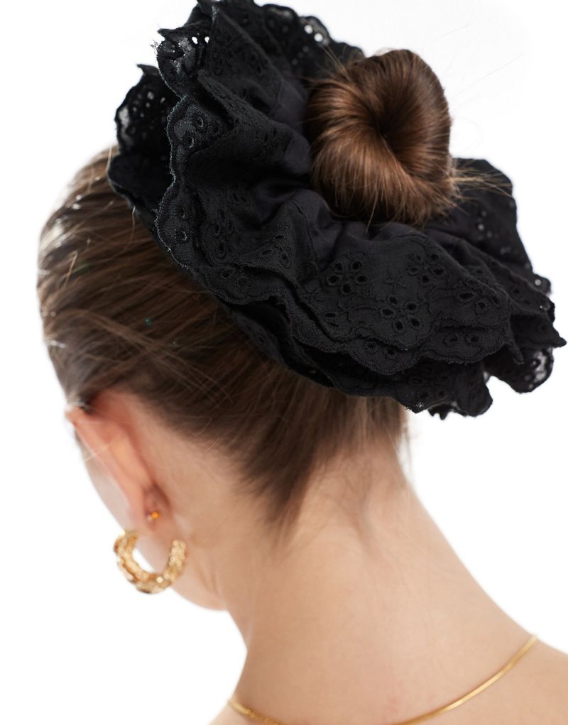 ASOS DESIGN scrunchie hair tie with eyelet detail in black ASOS DESIGN