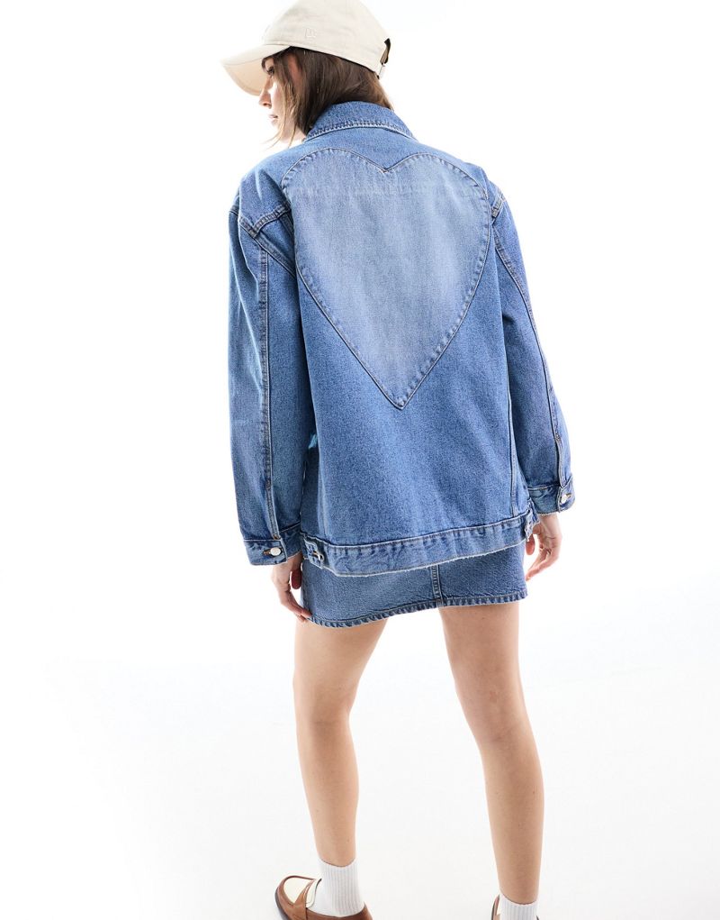 Miss Selfridge oversized heart detail denim jacket in light blue wash Miss Selfridge