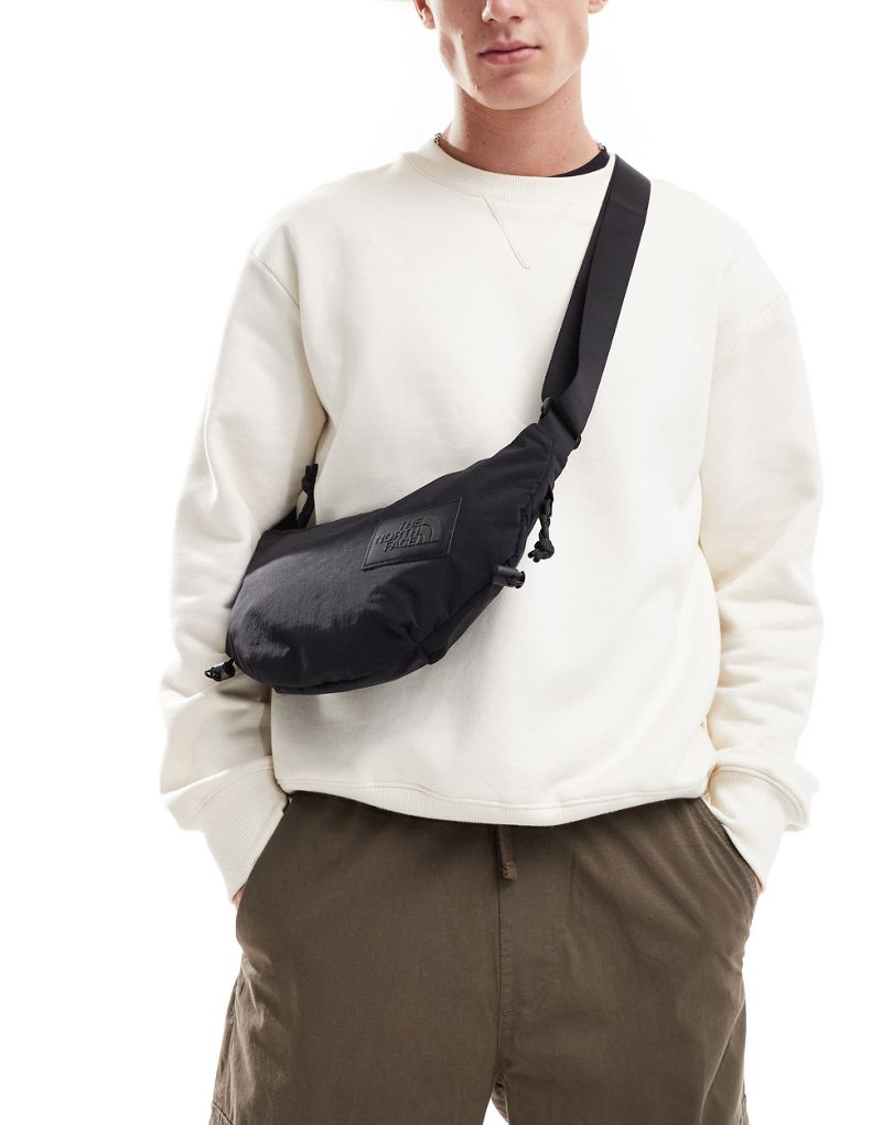 The North Face Never Stop sling cross body bag in black The North Face
