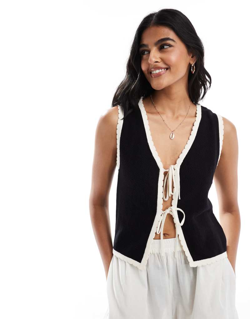 ASOS DESIGN knitted vest with contrast tipping in black and cream ASOS DESIGN